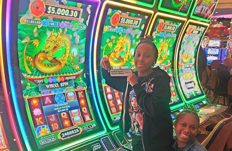 Iyana won $24,688.28 playing Dragons Wealth
